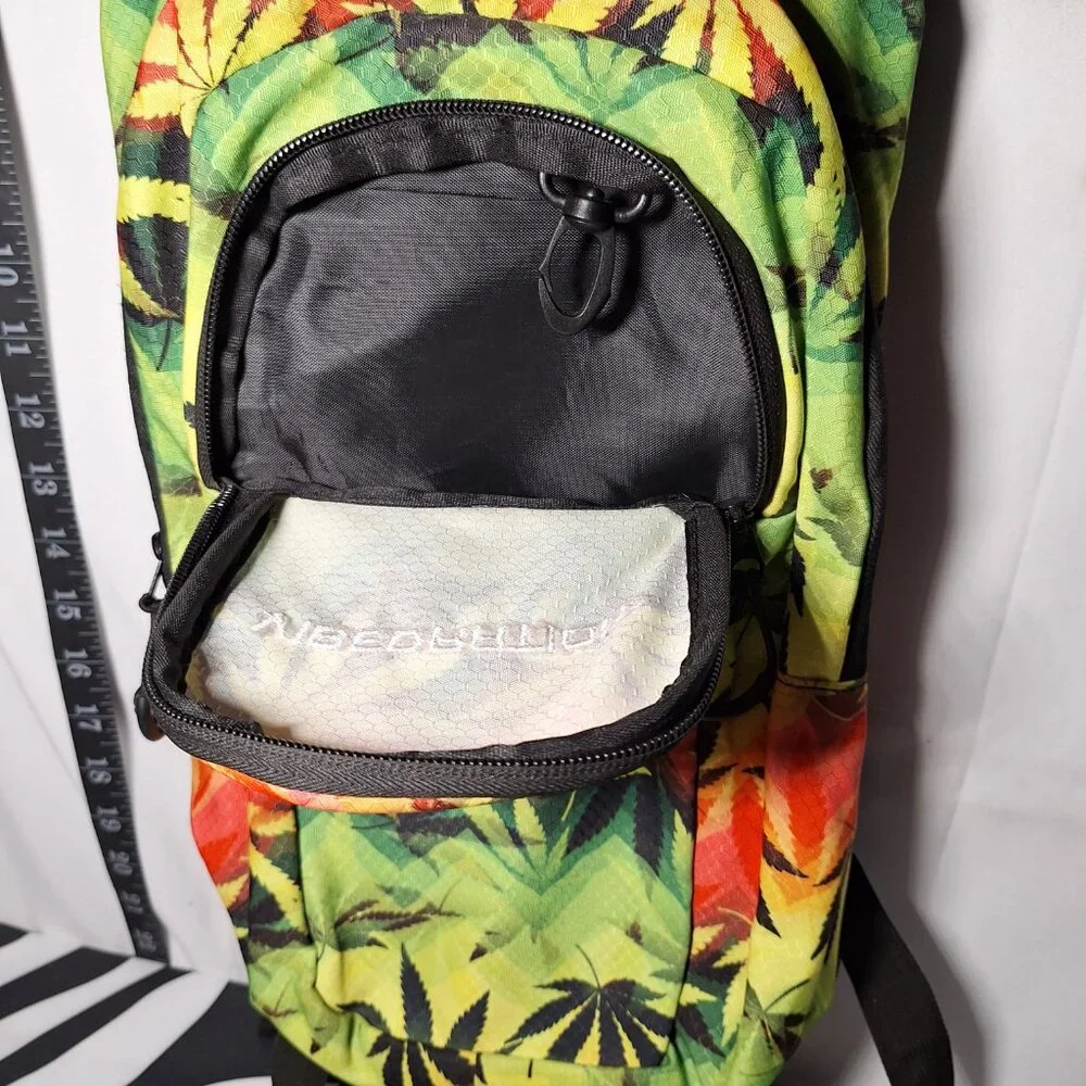 Vibedration Hydration Backpack w/o bladder - green, orange, black leaves - used